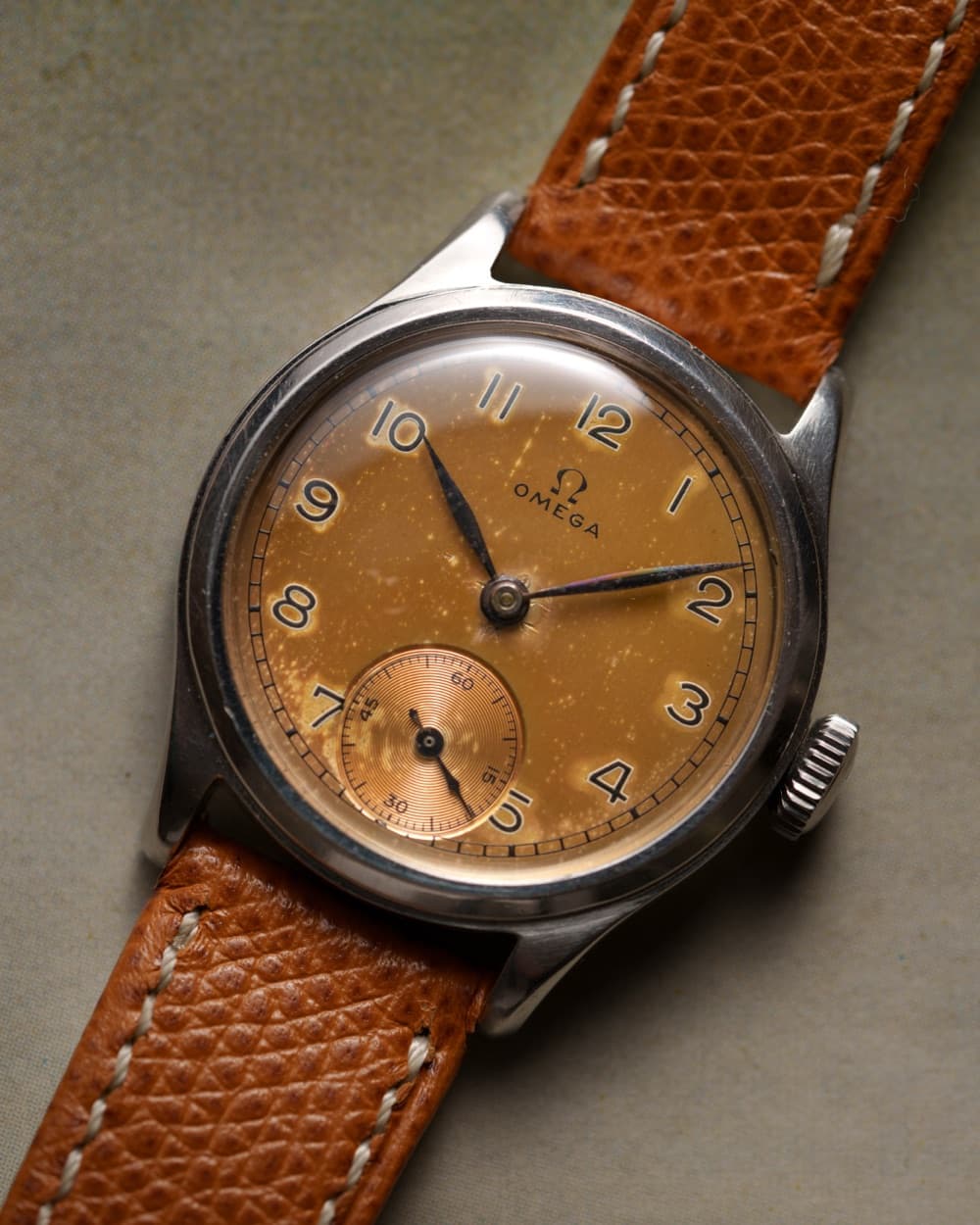 Vintage Omega with tropical brown dial on a tan leather strap
